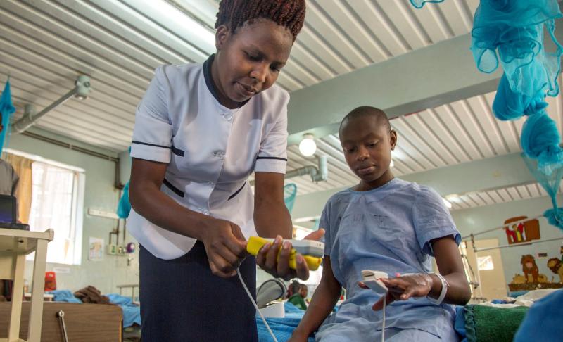 Nurse and patient in Kenya